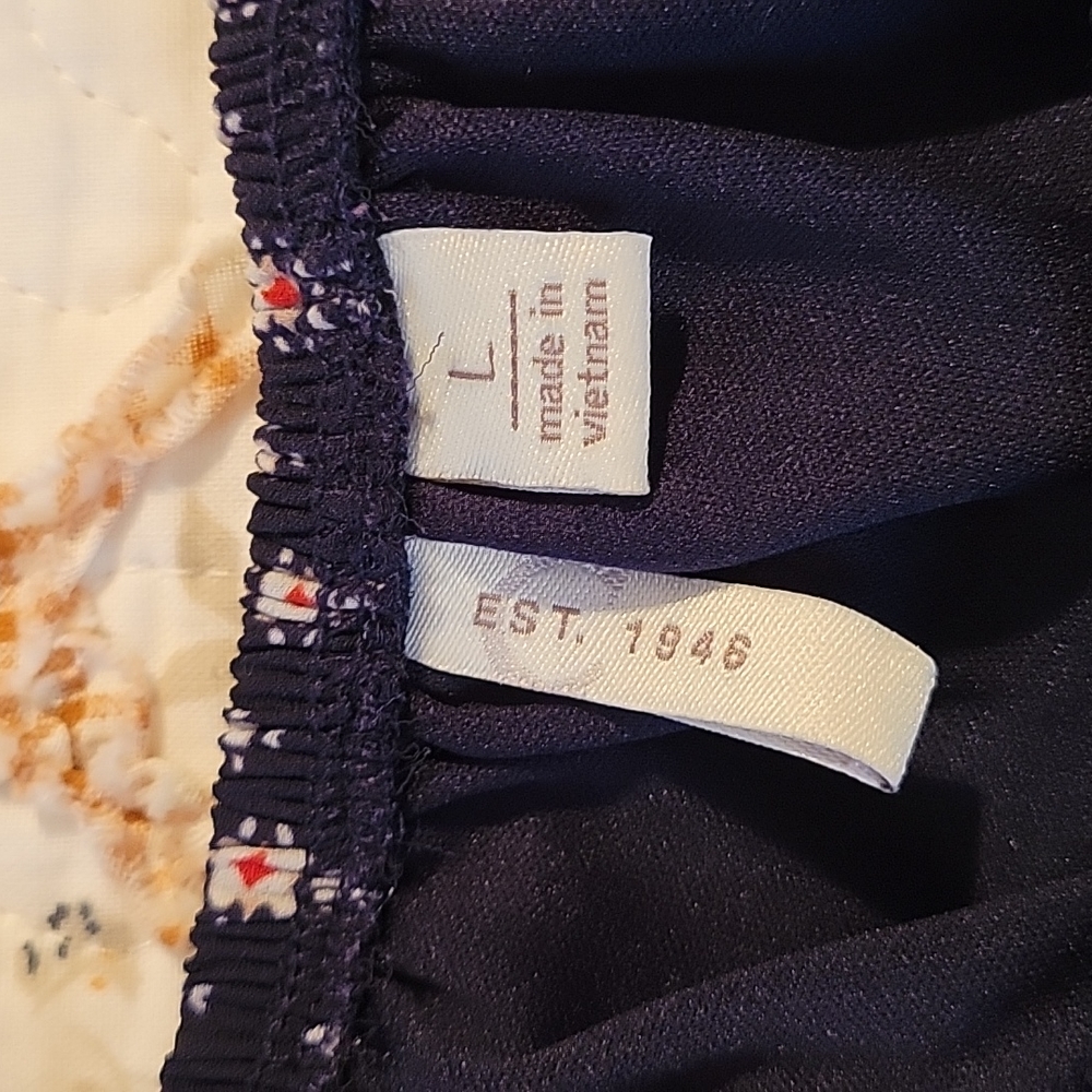 EST. 1946. One piece pull up outfit. Navy Blue, with orange and white accents.